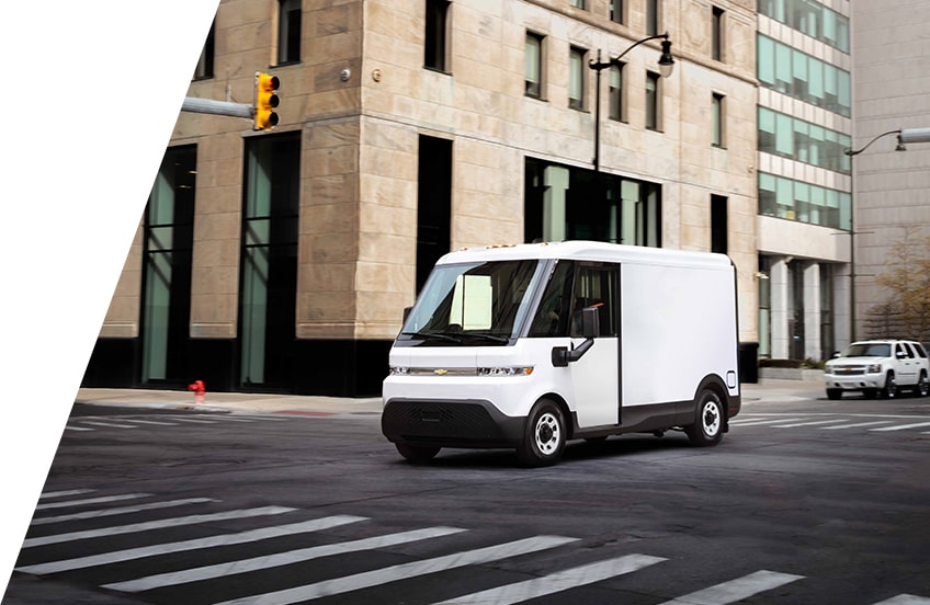 A Chevrolet BrightDrop EV driving in the city.