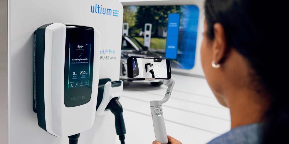 A person charging an Ultium-powered EV.