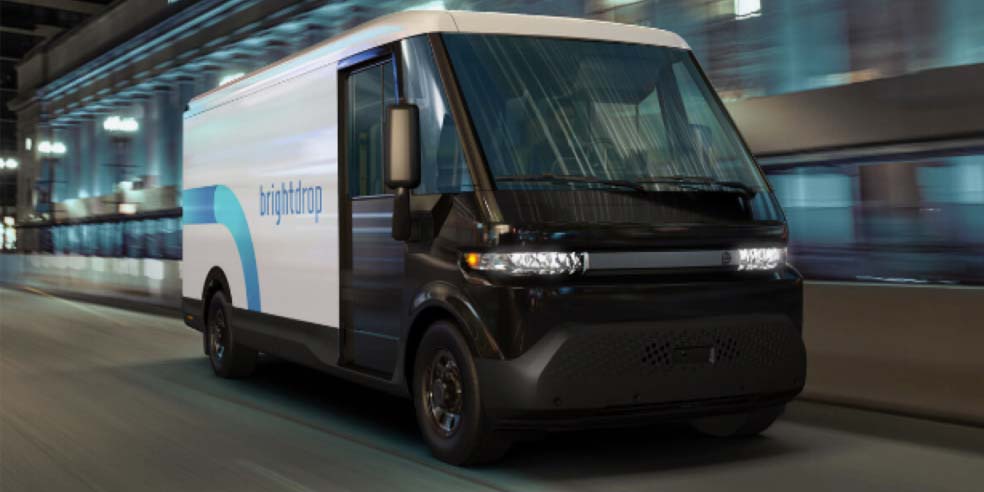 A BrightDrop Zevo EV Delivery Van driving alone on a city.