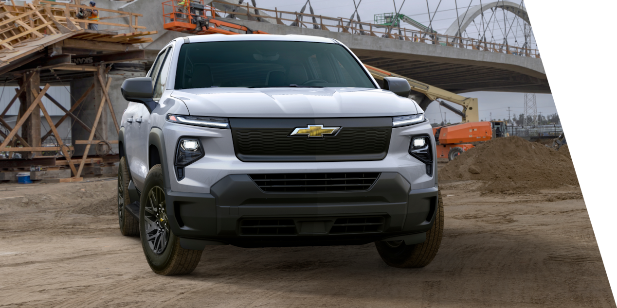 2024 GM Envolve Chevrolet Silverado EV Work Truck parked on a construction site.