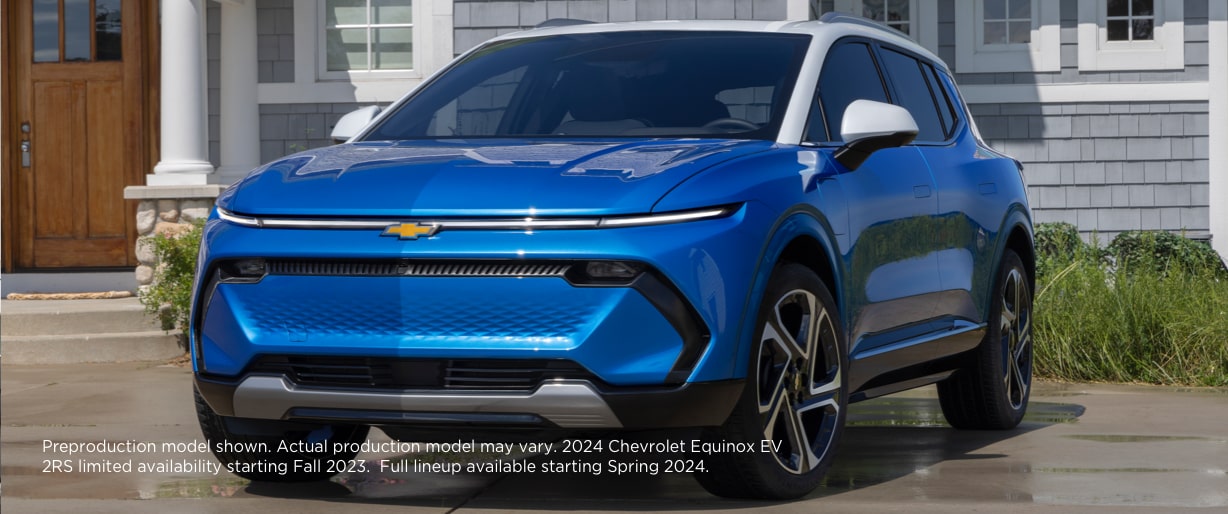 The 2024 Equinox EV parked in front of a home.