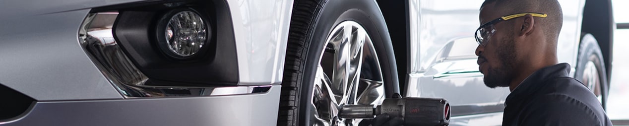 A GM Fleet technician repairing a GM Fleet vehicle.