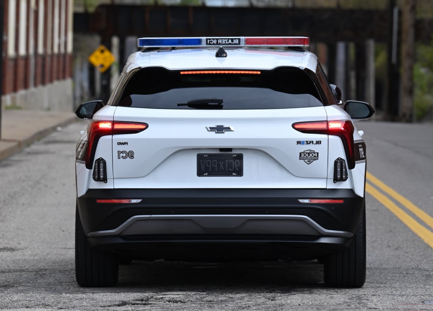 Back view of the GM Envolve Chevrolet Blazer EV PPV driving on a road.