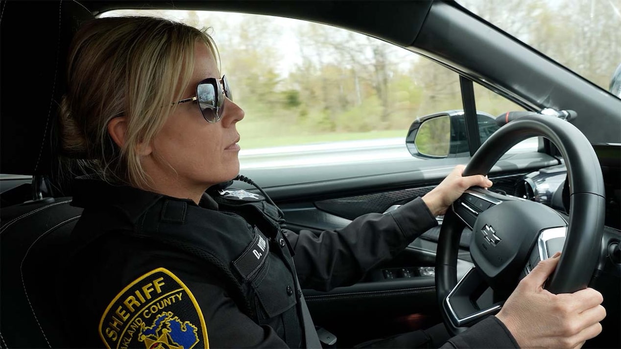 A police personnel driving the Chevrolet Blazer EV PPV.