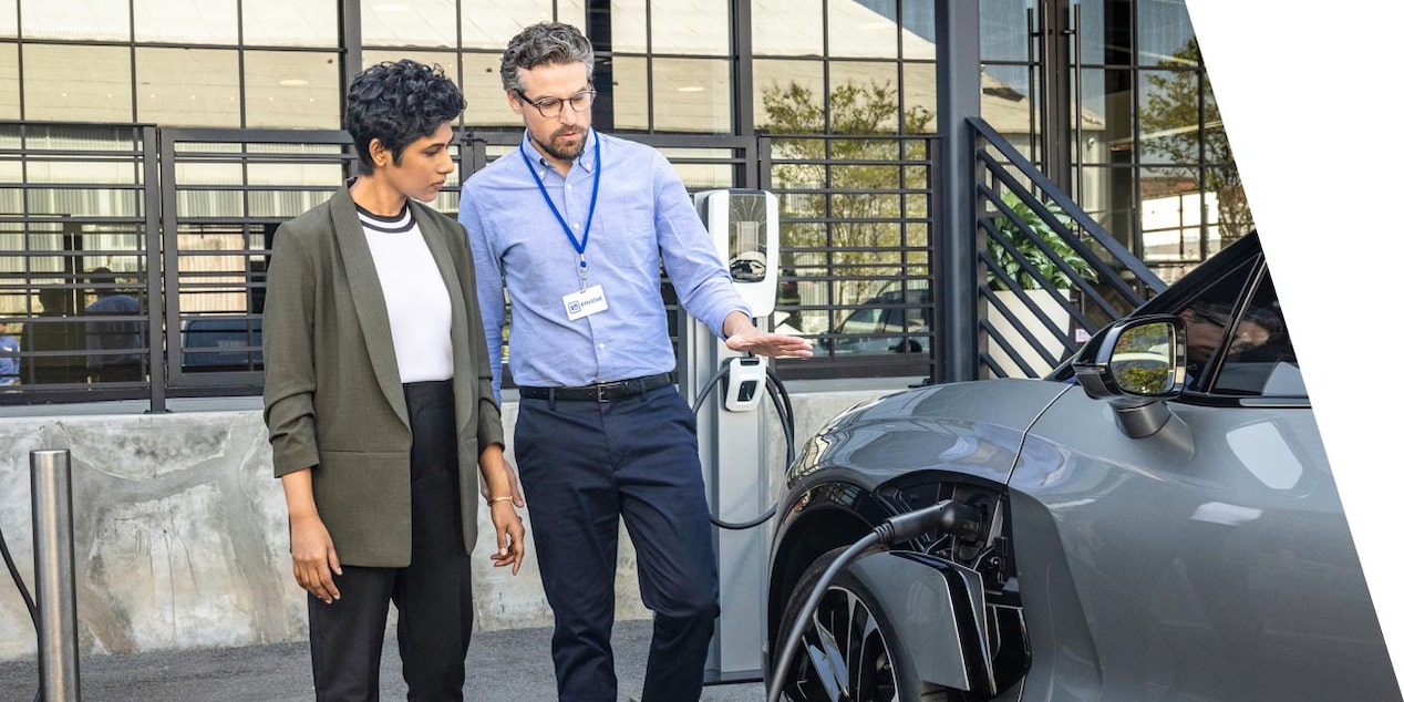 A GM Government Fleet agent showing a client a Fleet vehicle.