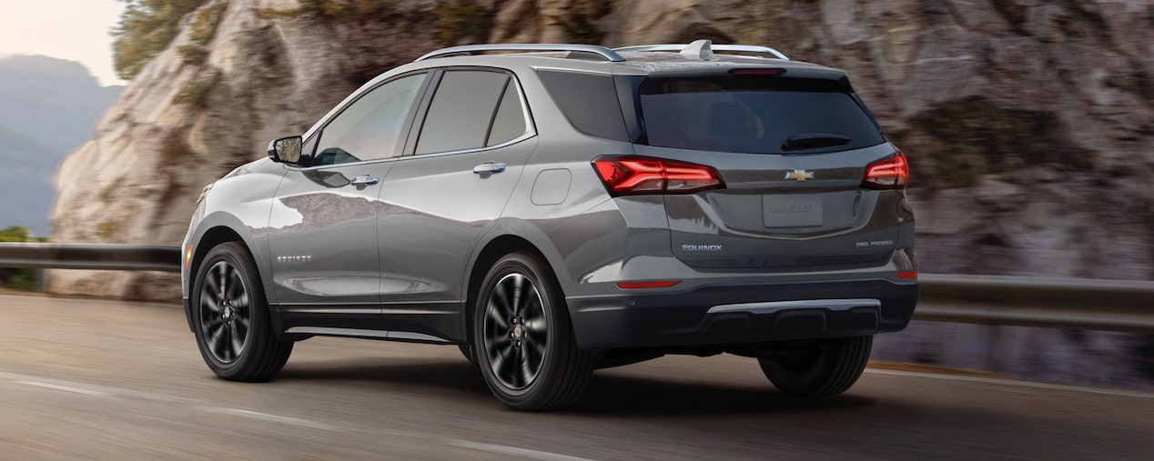 2024 Chevrolet Equinox driving alone on a mountain road.