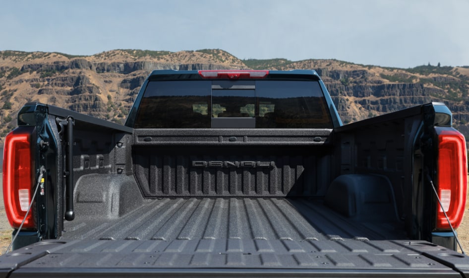 Spacious truck bed of a GM Envolve vehicle.