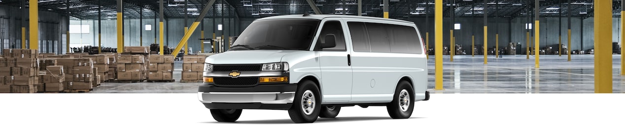 2024 GM Envolve Chevrolet Express Passenger Van parked inside a warehouse.