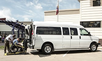 GM Envolve Accessibility Upfit parked outside a building.