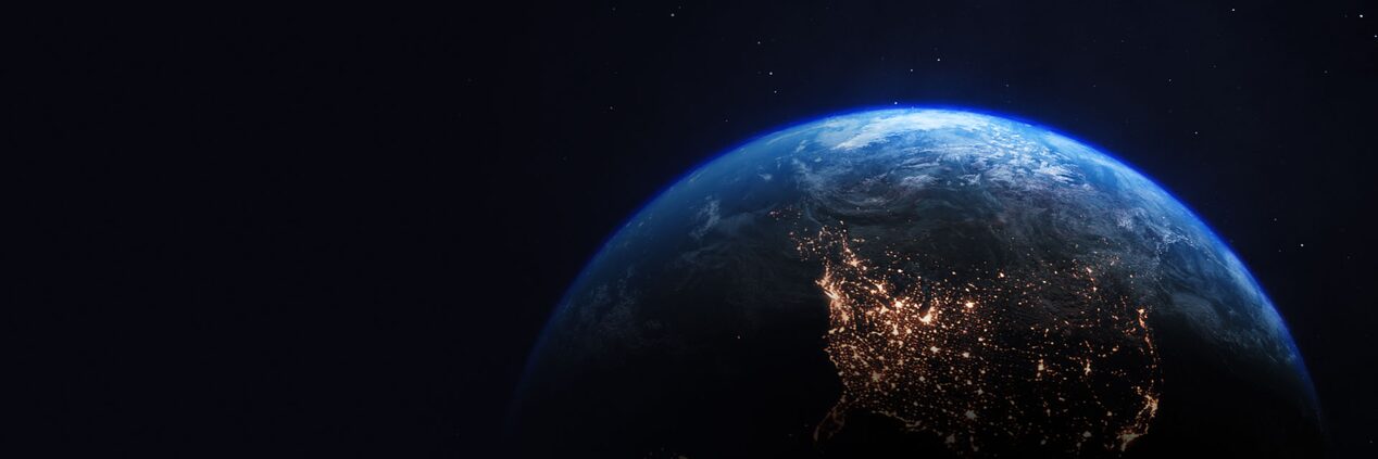 View of Earth from Outer Space With Bright Lights of Human Activity Visible on the Continents