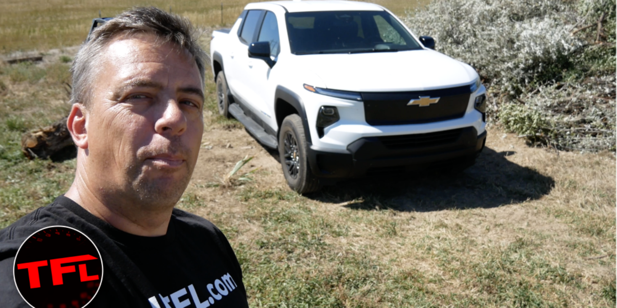 A Man Posing for a Picture with a Chevrolet Silverado EV Truck