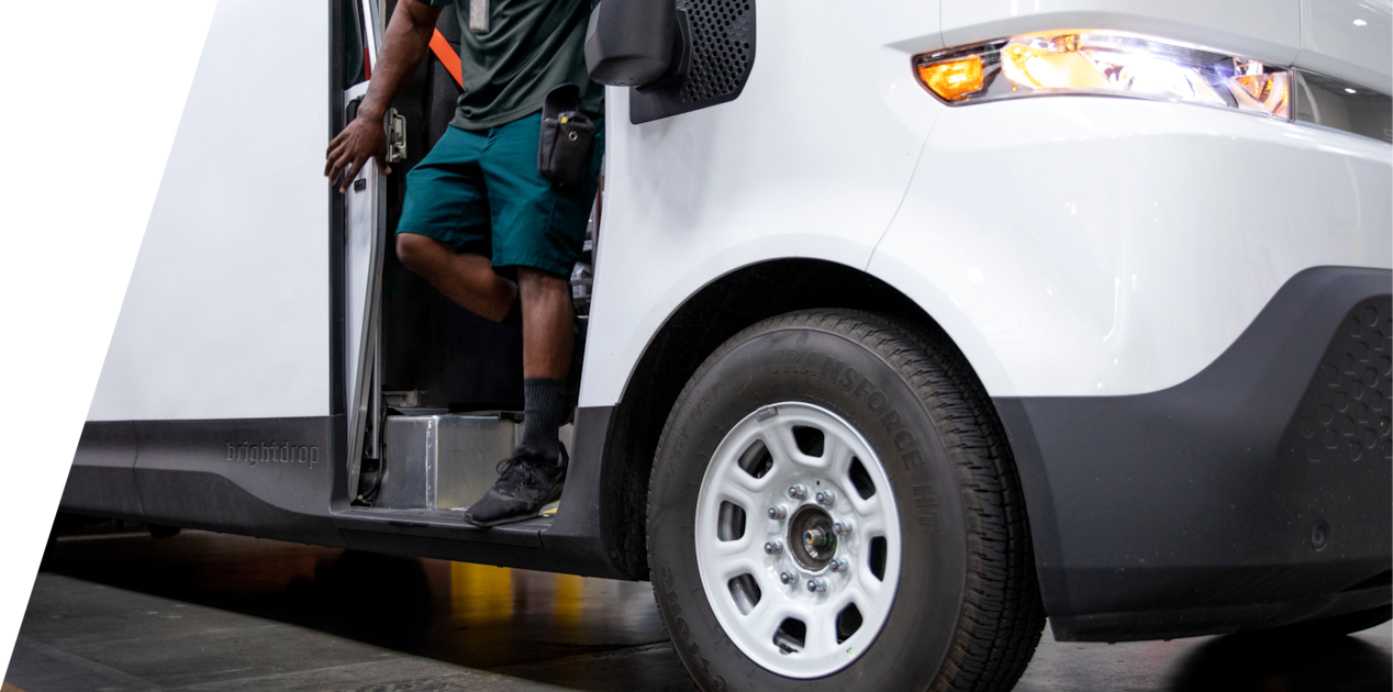 Close-up View of a Person Stepping Out of the BrightDrop Zevo Electric Delivery Vehicle