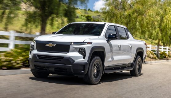 A Chevrolet Silverado EV Driving on a Rural Road