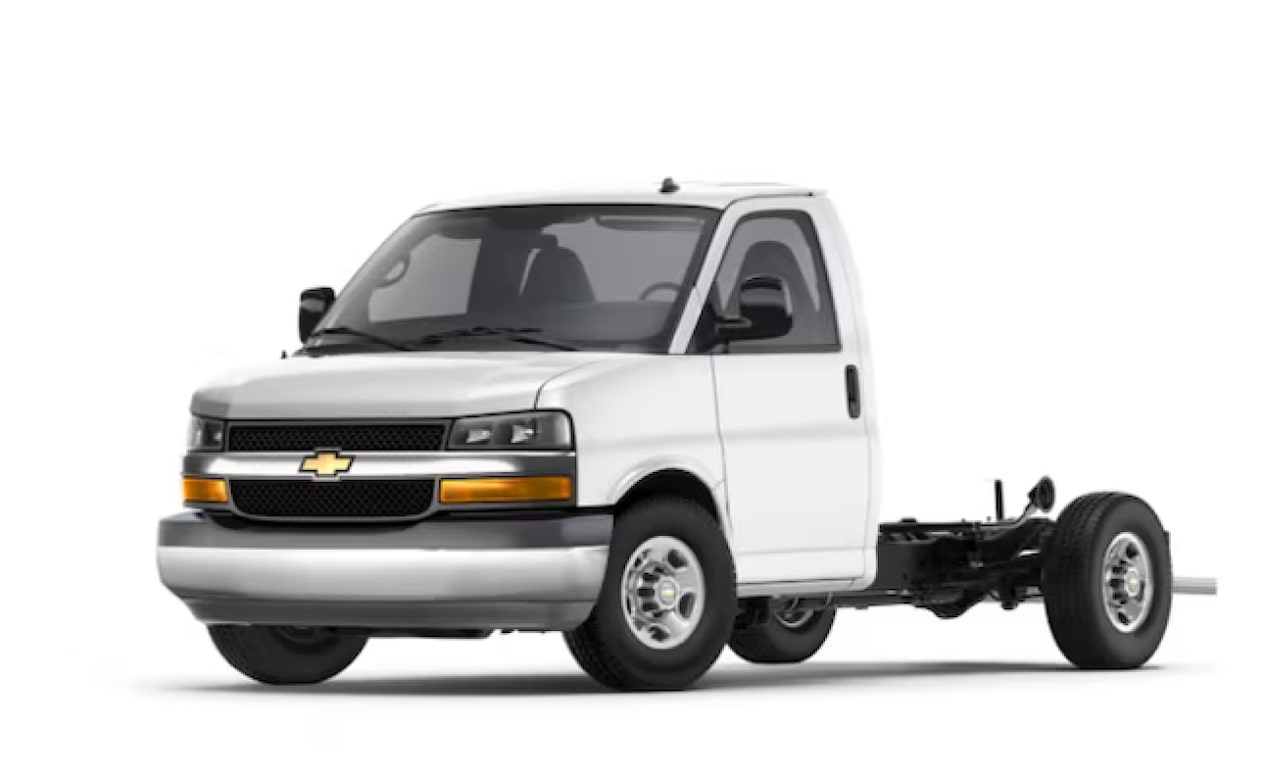 A three-quarter shot of a white 2025 Chevrolet Express