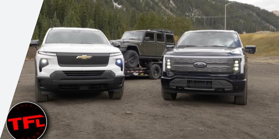 A Chevrolet Truck and a Ford Truck Parked Side by Side