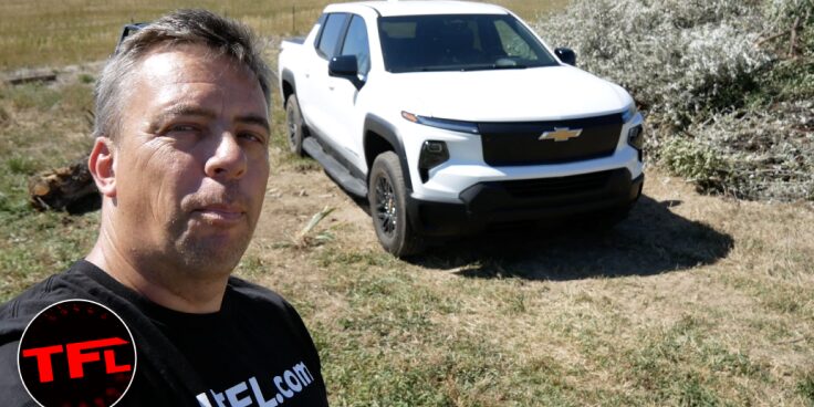 A Man Posing for a Picture with a Chevrolet Silverado EV Truck