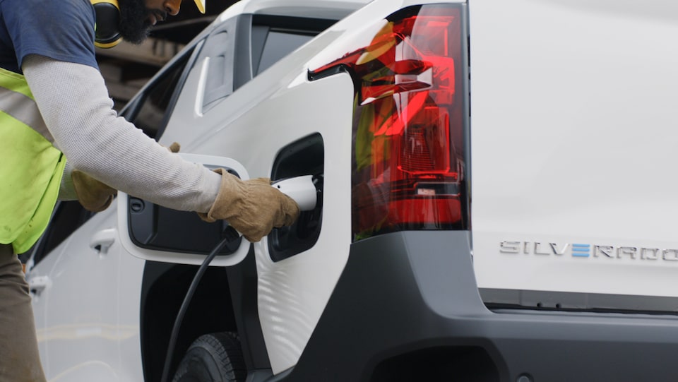 An exterior closeup shot of the charging port for the 2024  Silverado EV.