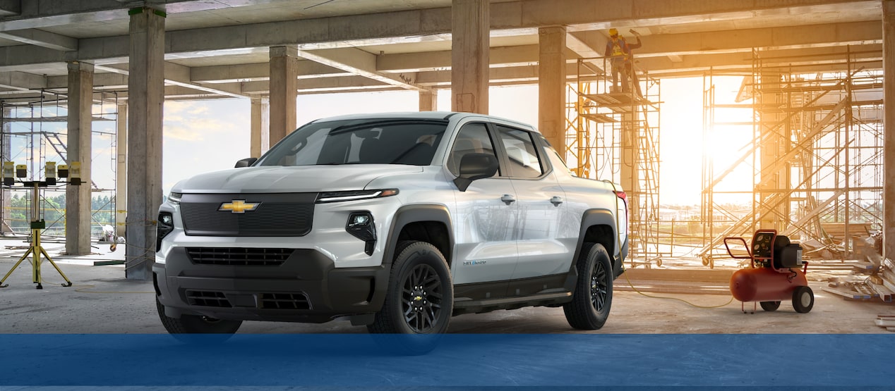 Chevrolet Silverado Electric Truck Parked at a Work Site with Tools Nearby