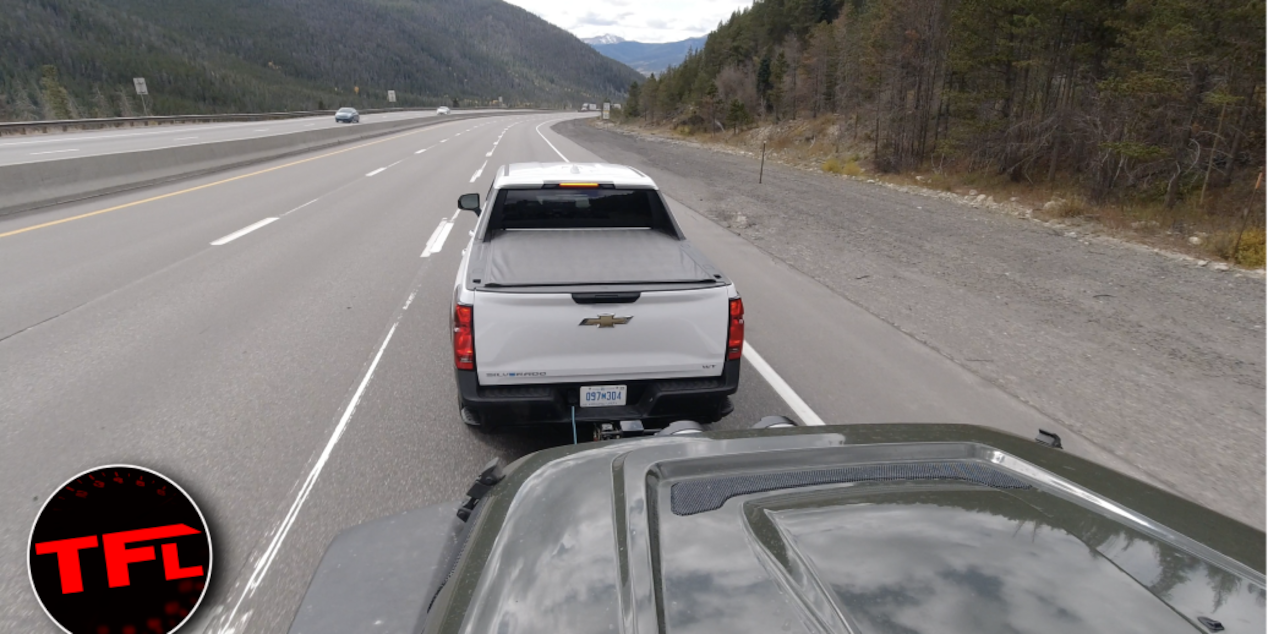 Rear View of a Chevrolet Truck Hauling a Trailer