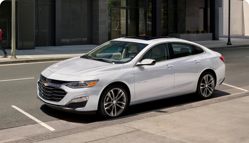 Front Side View of a Chevrolet Malibu Parked In Front of a Business