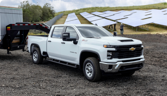 Front Three-Quarters View of a Chevrolet Silverado Heavy Duty Truck Parked at a Job Site