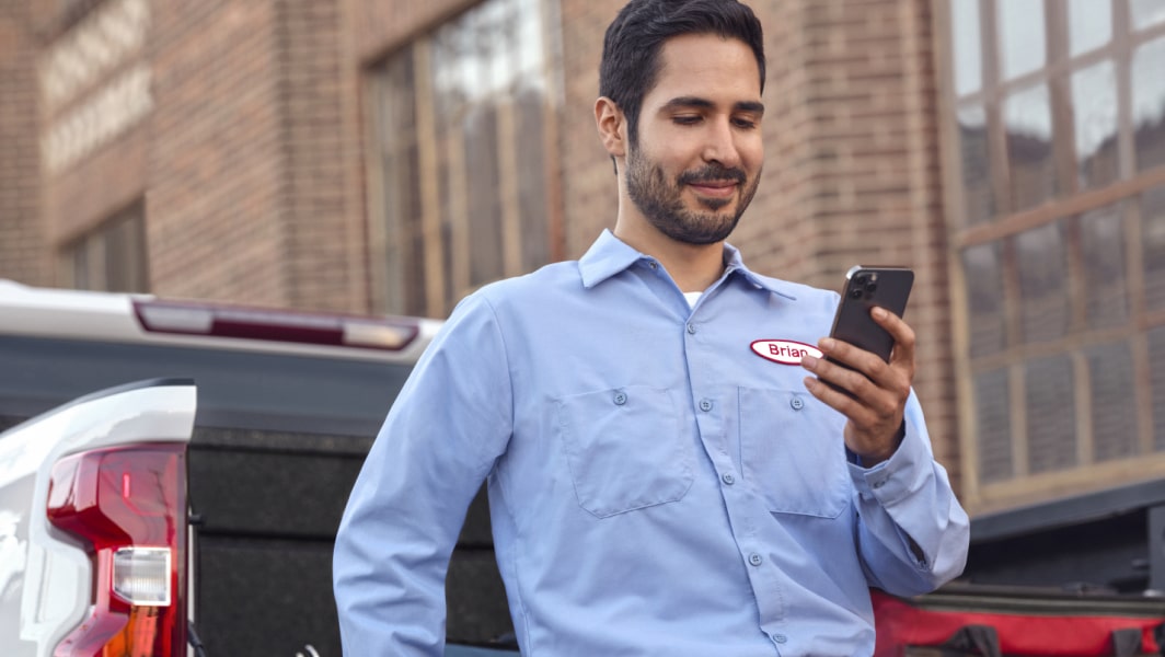 Man using OnStar on his mobile phone.