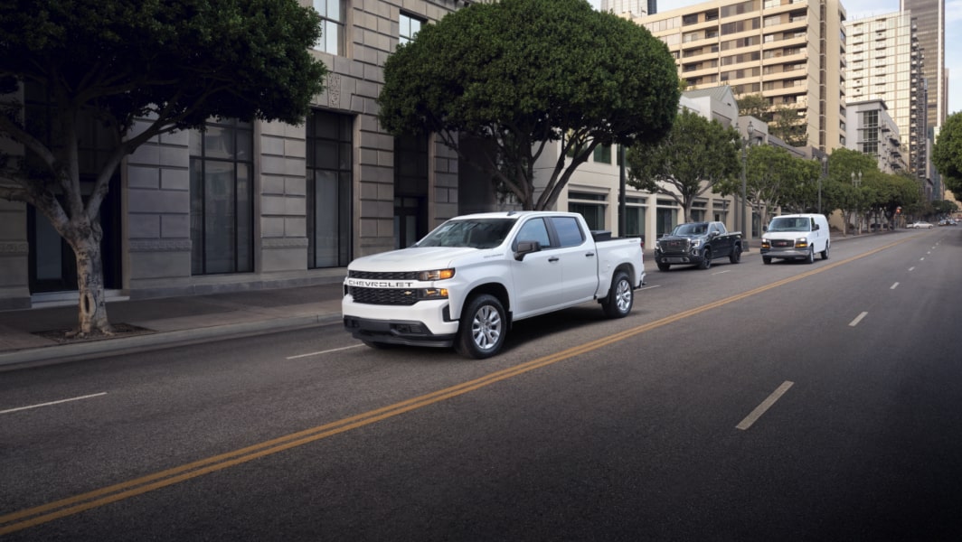 Truck driving through city streets with OnStar.