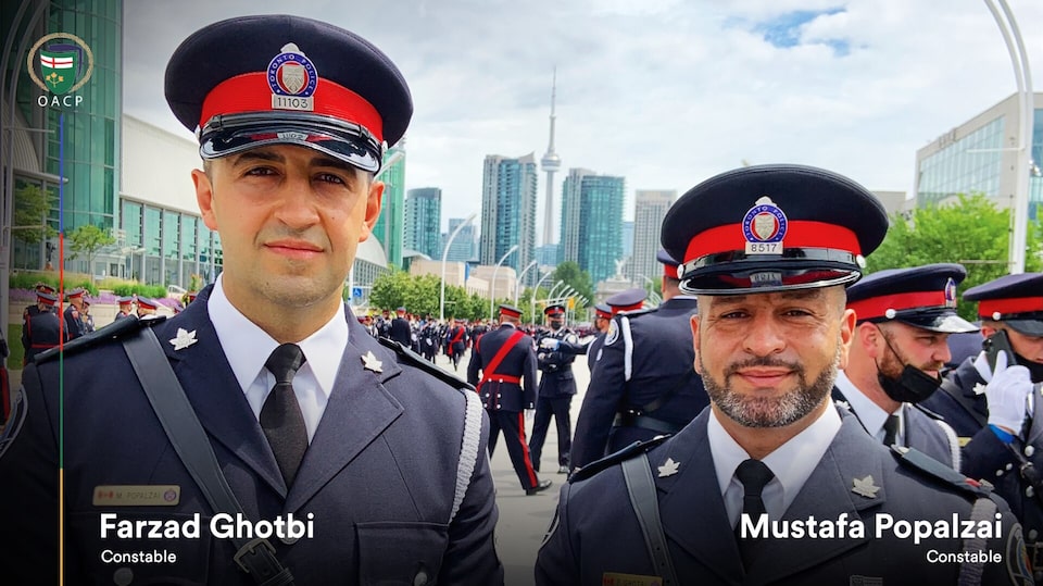 Constable Farzad Ghotb and Constable Mustafa Popalzai of the Toronto Police Service.