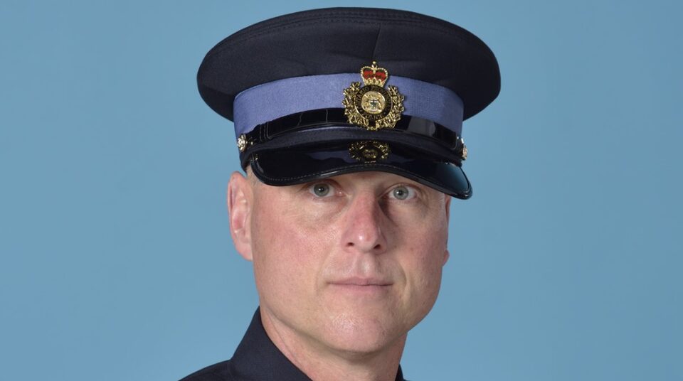 A police dog running Provincial Constable Keith Lindley