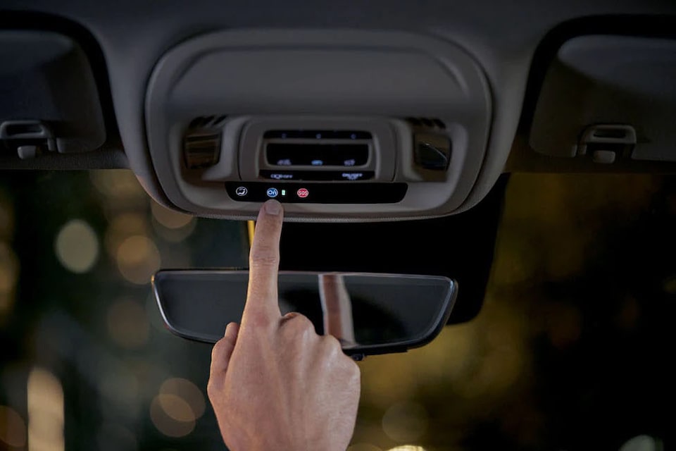 Pressing the OnStar button during a crisis.