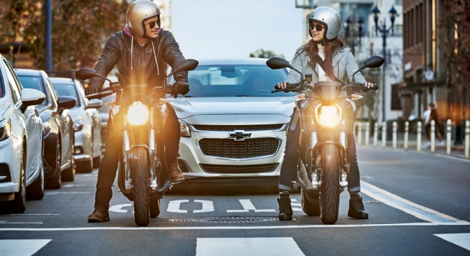 Two Motorists Stopped at a Red Light 