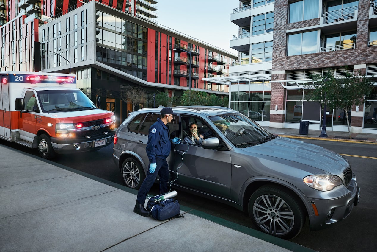 OnStar aids EMT first responders to help a passenger through the window.